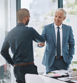 congratulating-him-job-well-done-cropped-shot-two-businessmen-shaking-hands-office