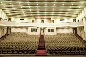 empty-auditorium-with-beige-chairs-theatre-conference-hall