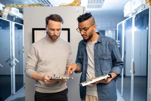 mainframe-engineers-discussing-motherboard