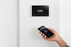 person-using-smartphone-automated-home